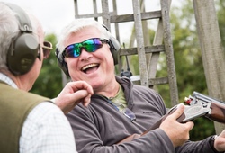 Clay Shooting man laughing