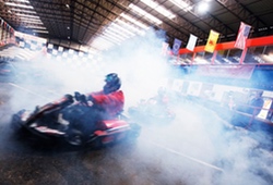 Indoor Karts going through smoke