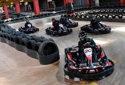 Indoor karting racing around a bend