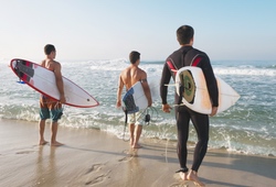 3 Surf dude walking into the sea