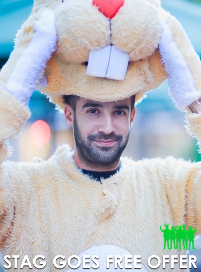 Groom putting on his fancy dress