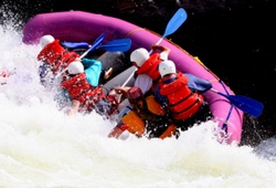 White water raft tipping